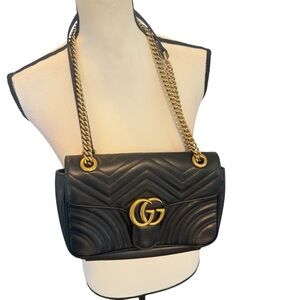 Authentic  black leather Gucci Shoulder Bag with Gold Accents.